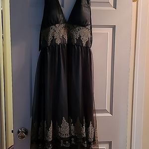 A beautiful Adrianna Papell, halter back dress with padded cups for comfort.